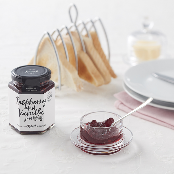 Hawkshead Relish Company Raspberry & Vanilla Jam - Open jar on laid table